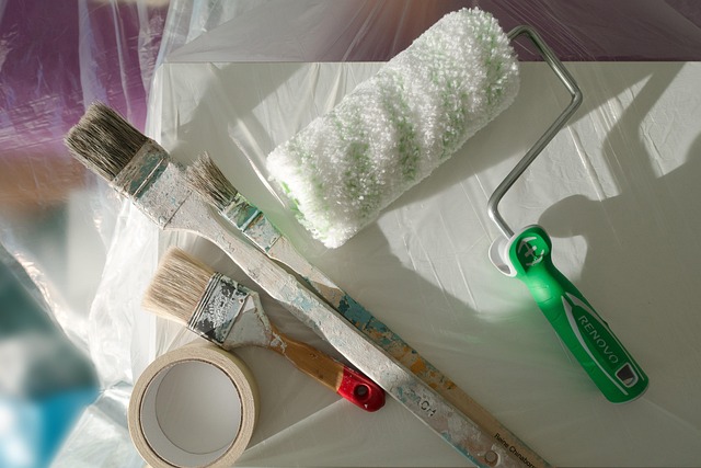 Painting tools, including brushes, a roller, and masking tape, ready for use. Proper preparation with these items ensures a smooth Everyday Renovations painting service timeline
