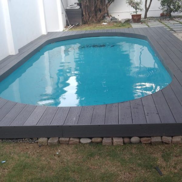 Pool Decking After 1 Before and after pool renovation by Everyday Renovation in Singapore, with decking